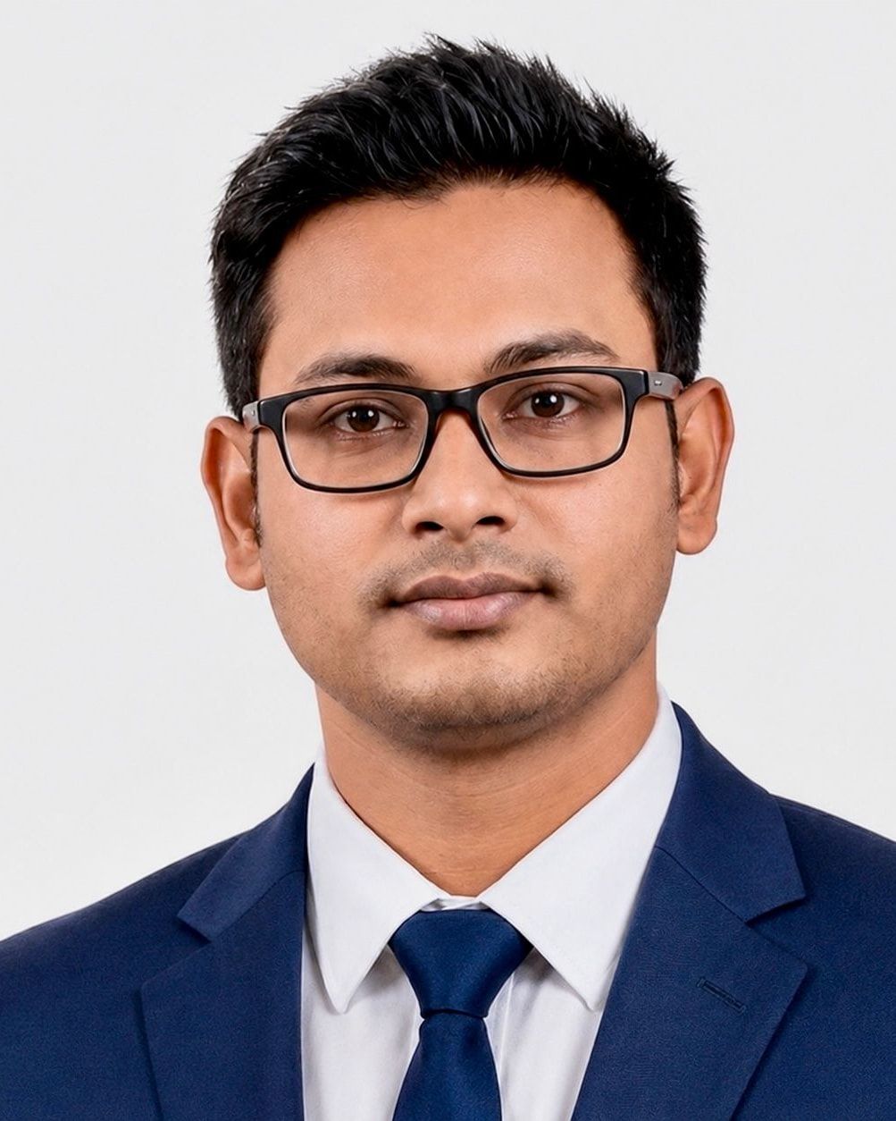 Portrait of Nazmul Hosen in a navy suit and glasses